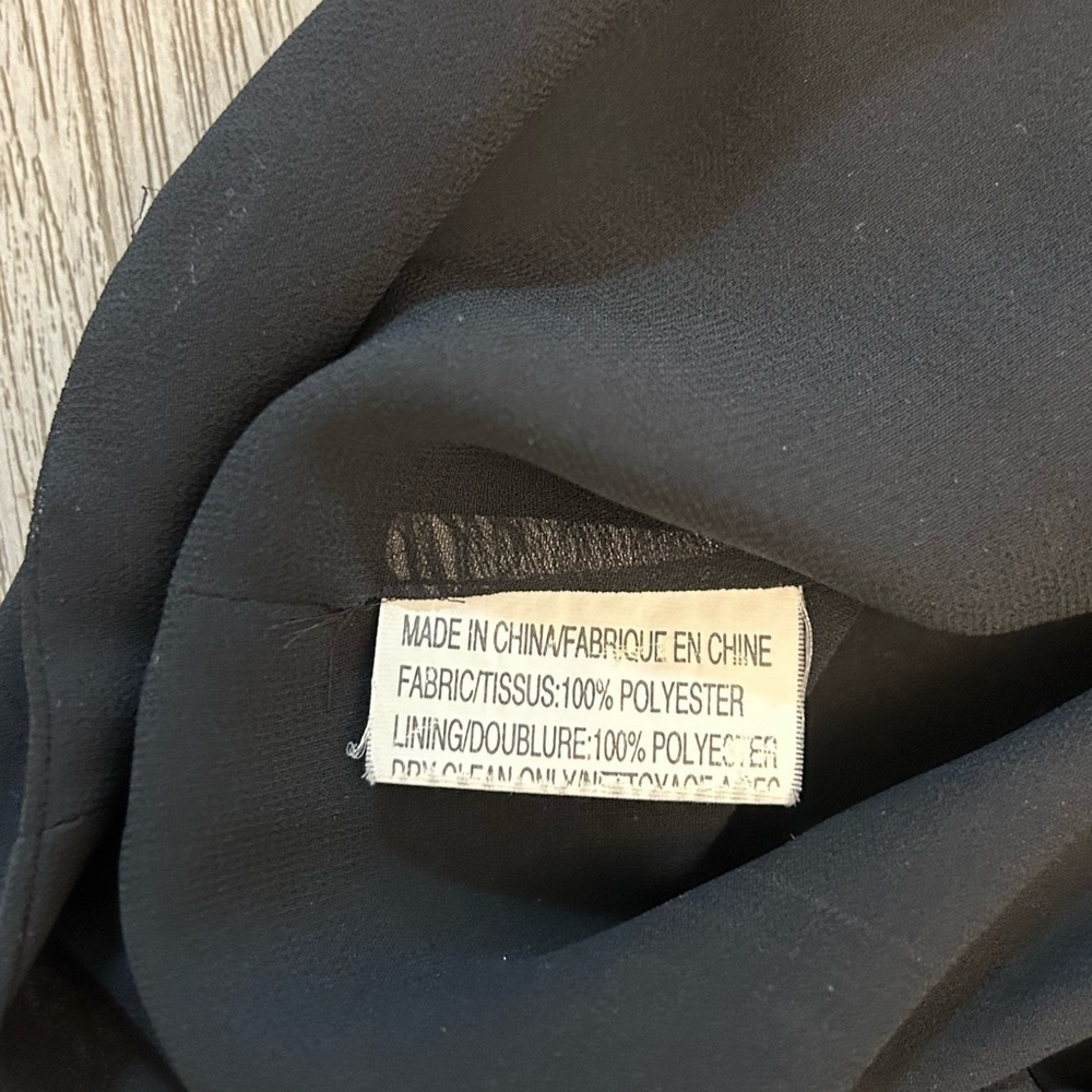 J.MICHAELS black sleeveless ruffle top in new condition. Pit to pit-19”. - Picture 6 of 10